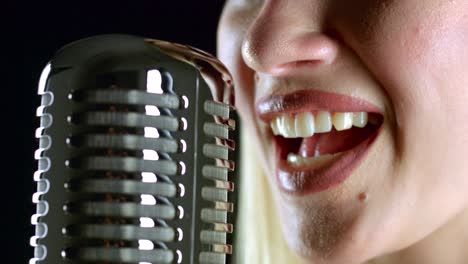 woman singing into a vintage microphone