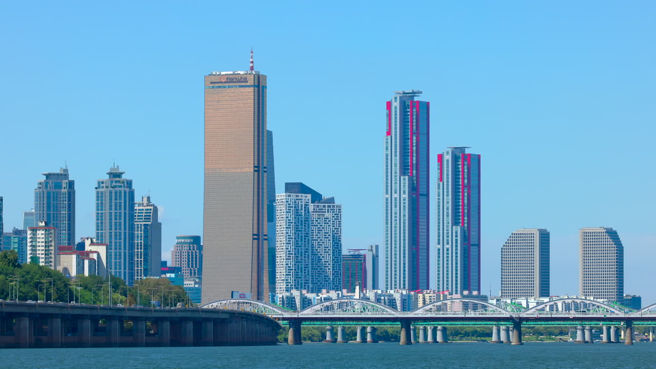 Closed up cityscape of buildings beyond a river