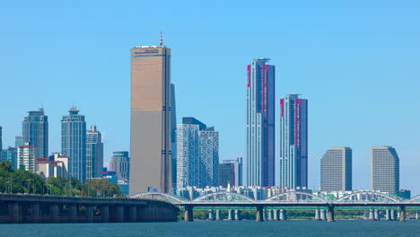 closed up cityscape of buildings beyond a river