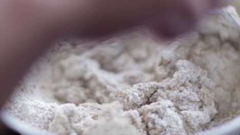 Mixing-a-cake-dough-with-flour-and-milk-close-up