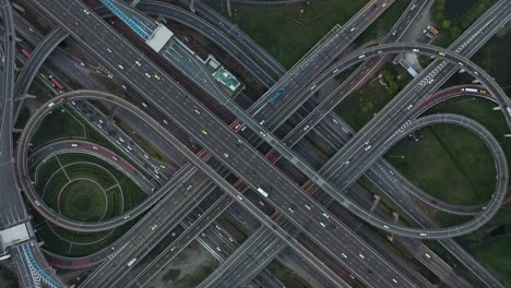 high angle looking top down view of complicate road and expressway intersection in bangkok city of thailand. shot by drone can use for transportation or abstract concept.