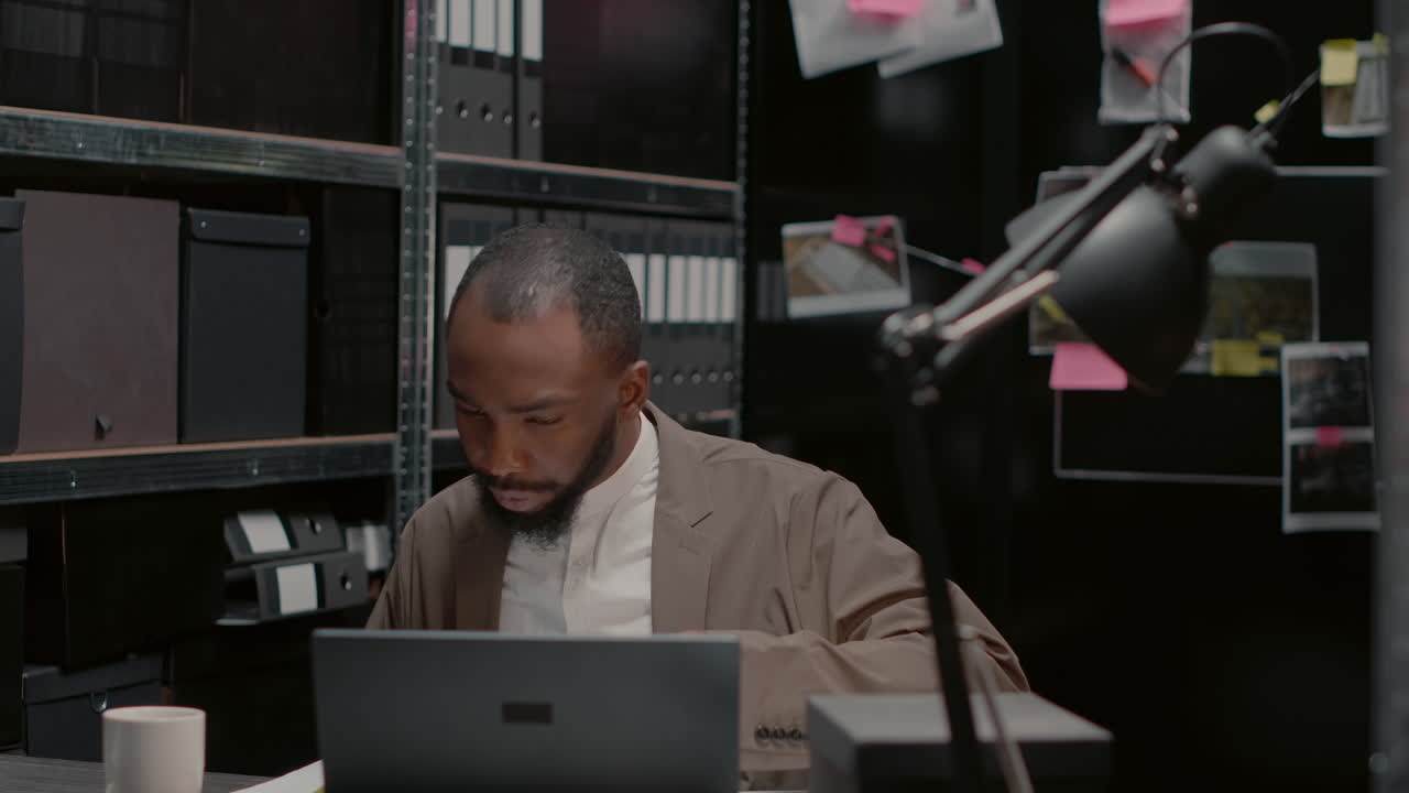 Detective working on a case in his office