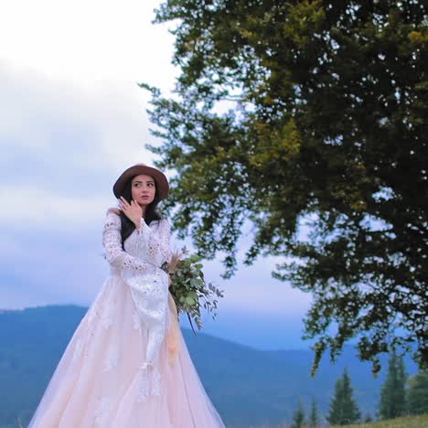 bride in luxury dress posing outdoors
