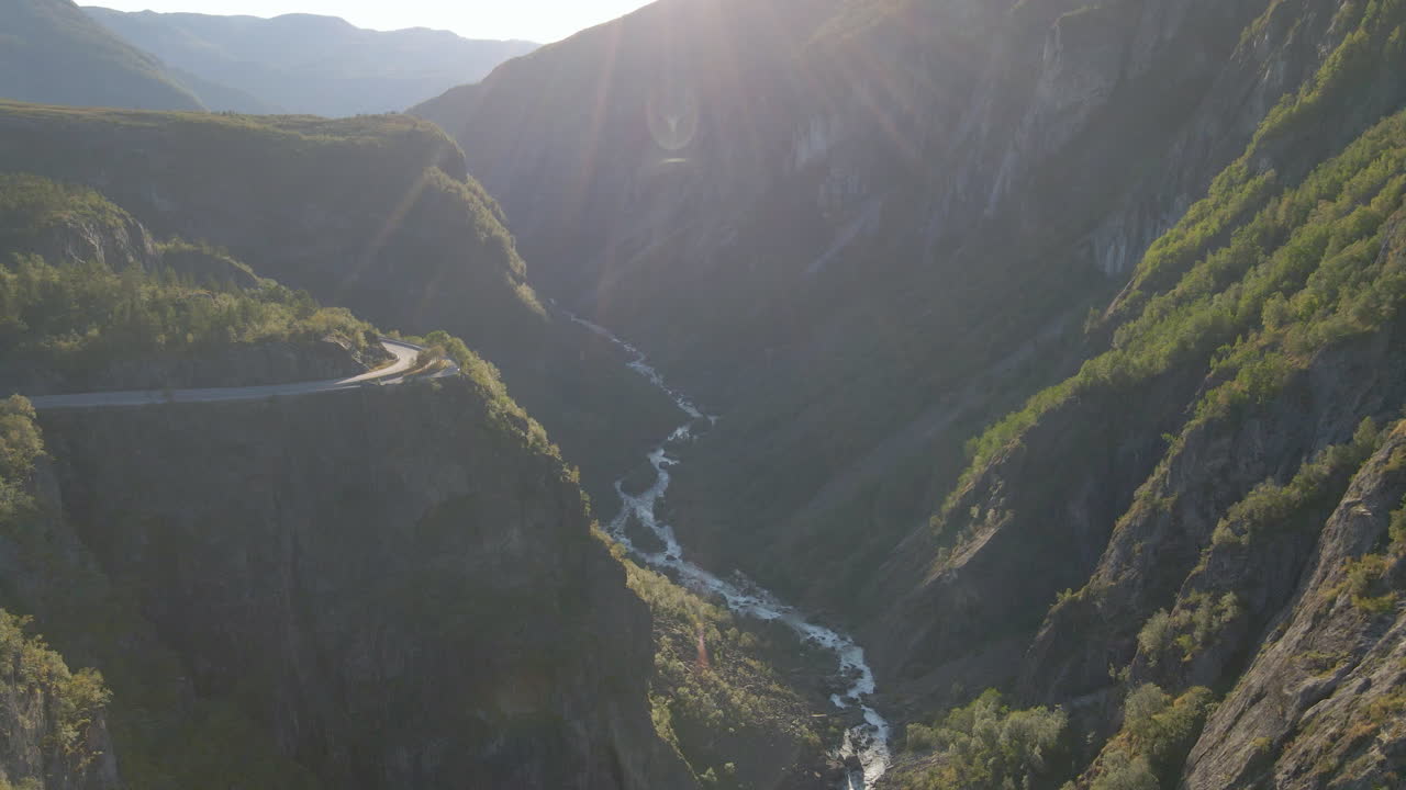 Winding road to Voring falls through dramatic Norwegian landscape