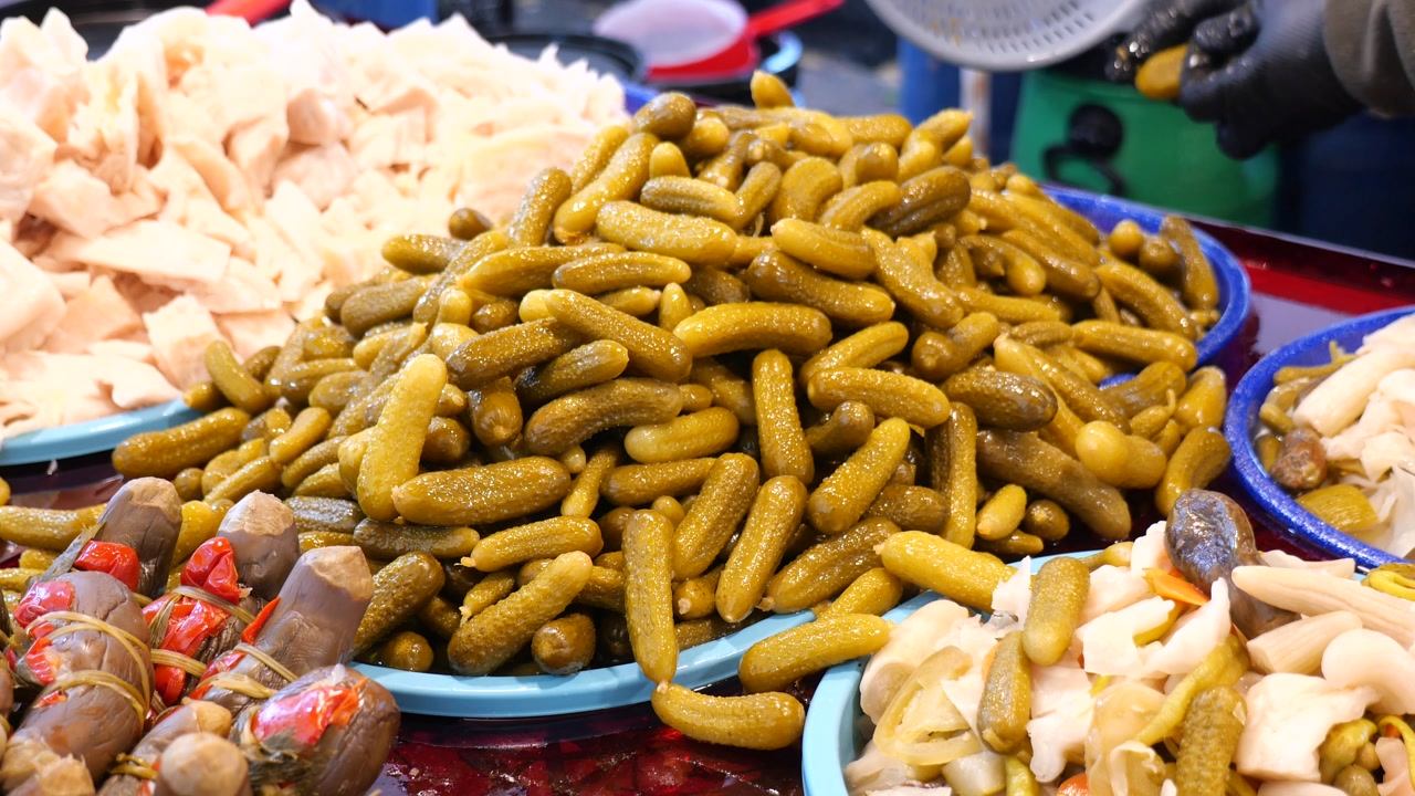 Close-up of Fresh Pickled Gherkins on Display at a Market Stall