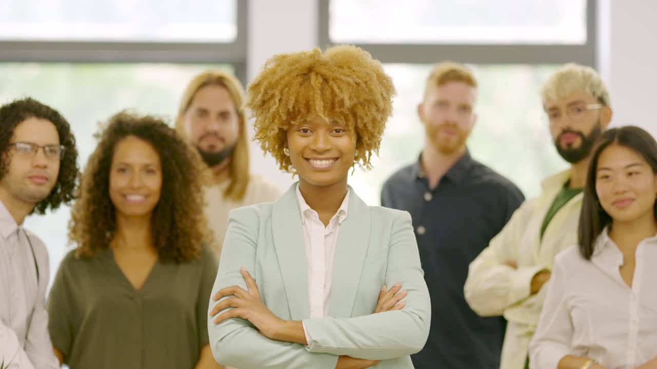 African woman leading a work team in the office