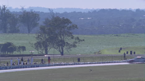 a race car speeds down the track 1
