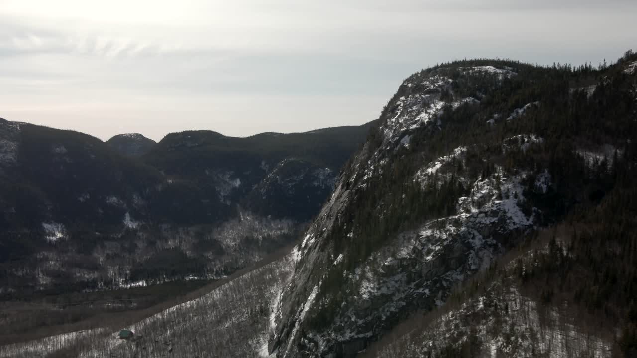 Mountain Ridges With Dense Alpine Woodland During Winter At Mont du Dome In Quebec, Canada