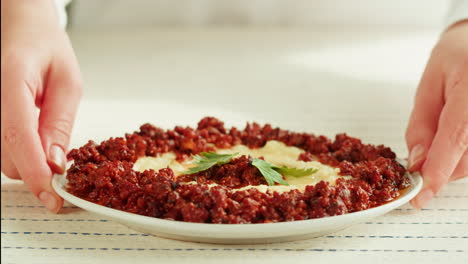 plate of middle eastern meat dish with mashed potatoes