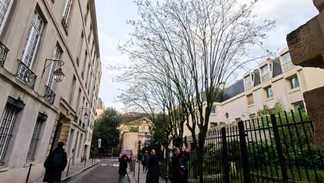 people walking on a parisian street