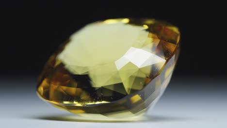 Polished-yellow-gemstone-rotates-and-sparkles