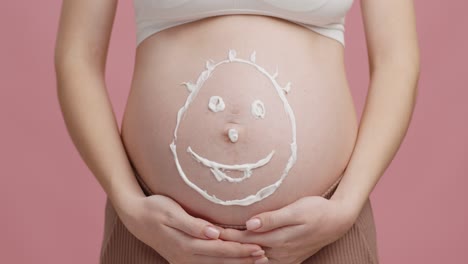 pregnant belly with smiley face drawing