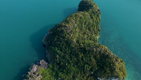 Aerial-drone-shot-over-Ha-Long-Bay,-blue-sea-and-limestone-islands-of-Lan-ha-bay