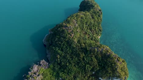 aerial drone shot over ha long bay, blue sea and limestone islands of lan ha bay