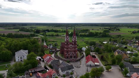 Panoramic-drone-shot-of-Sveksna-catholic-church-in-the-small-medieval-town-of-Silute