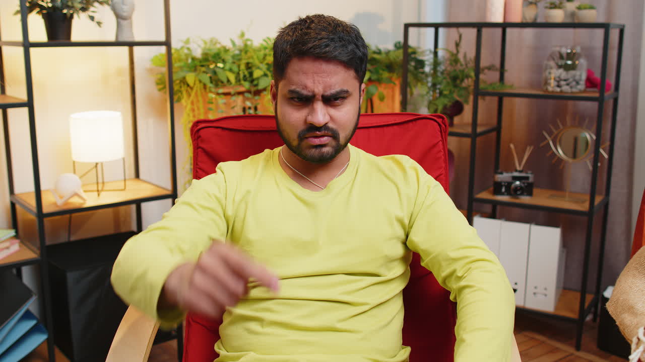 Strict unhappy man pointing finger to camera looking angry making choice accusing for mistake