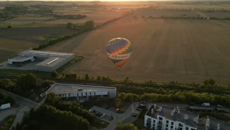 hot air balloon ride at sunset over rural landscape