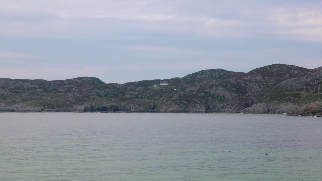 small cottages in the Scottish Highlands overlooking Achmelvich Bay