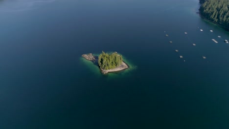 small island and oyster farming by the coast of vancouver island (british columbia - canada). drone footage.