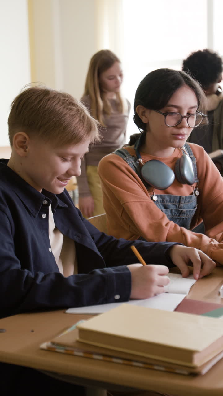 Students learning and writing in a classroom