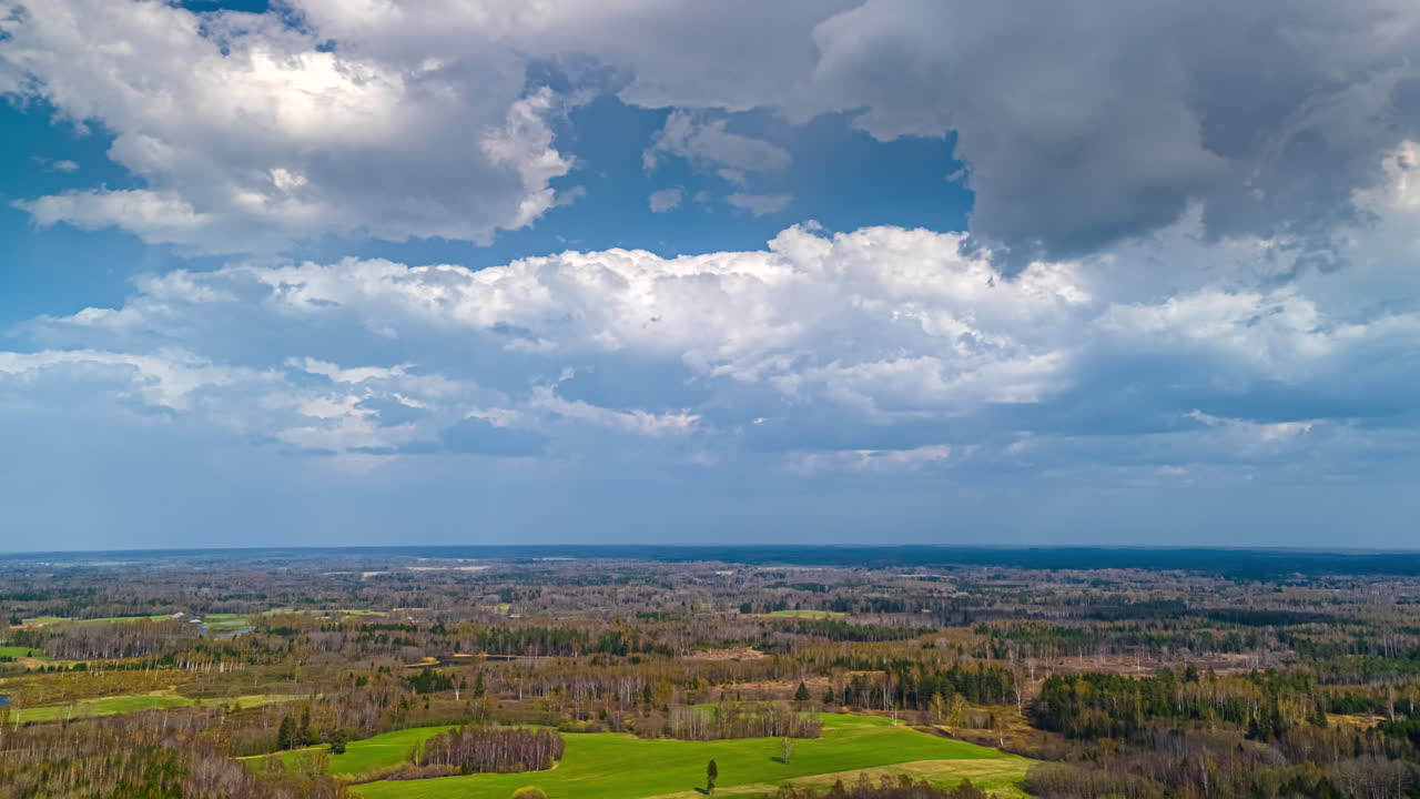 Remote field forest timelapse moving clouds cloudy skyline rural nature elevated POV