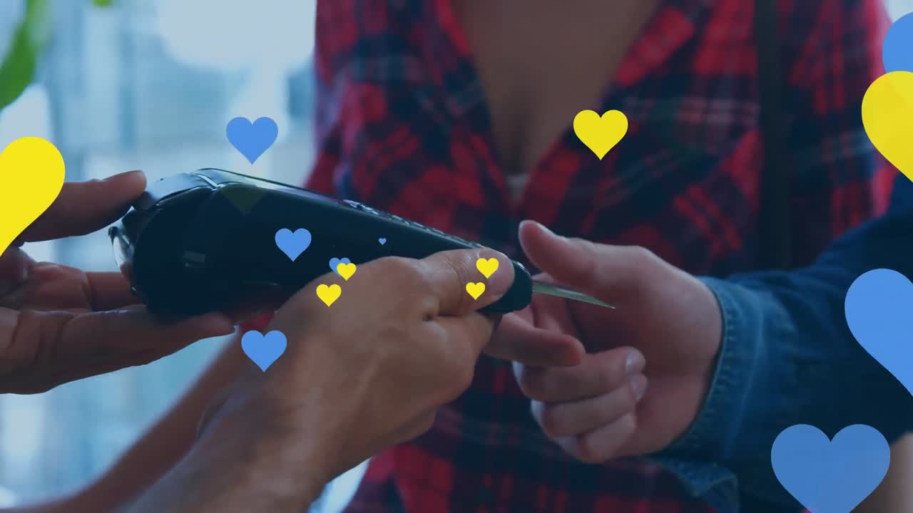 Animation of falling hearts over people using payment terminal