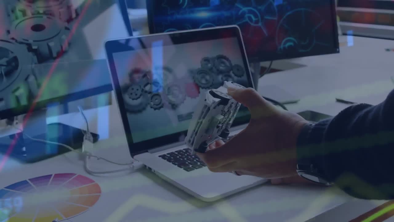 Animation of financial data processing over caucasian businessman using laptop in office