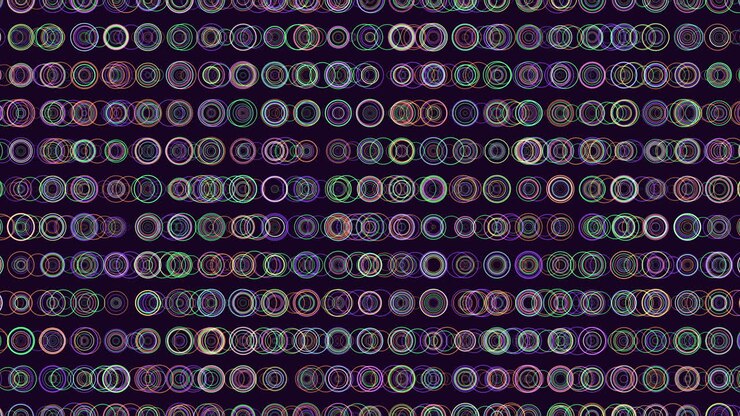 Intricate symmetrical pattern of overlapping circles on dark background