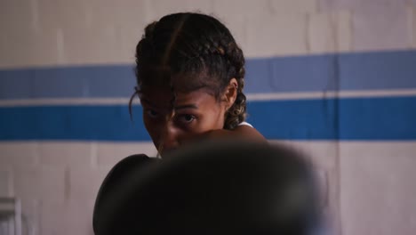 mixed race woman boxing