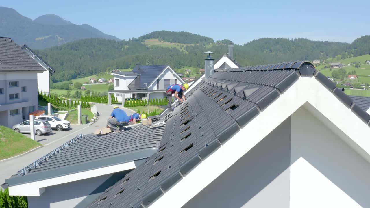 Installers initiate the work of setting up solar panels. Tracking shot