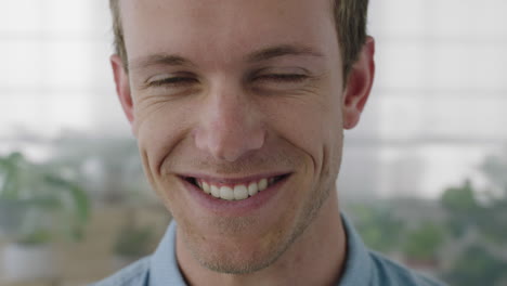 close-up-portrait-of-attractive-young-businessman-smiling-cheerful-enjoying-successful-startup-business-happy-caucasian-entrepreneur-office-background