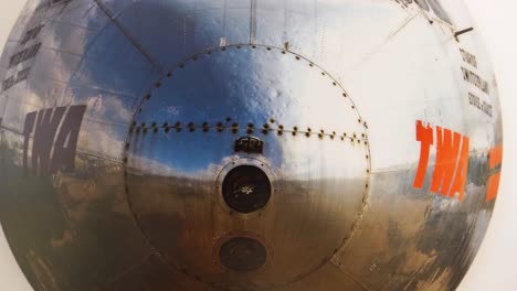 slow pull-out shot revealing an aircraft front hanging on the wall as decoration