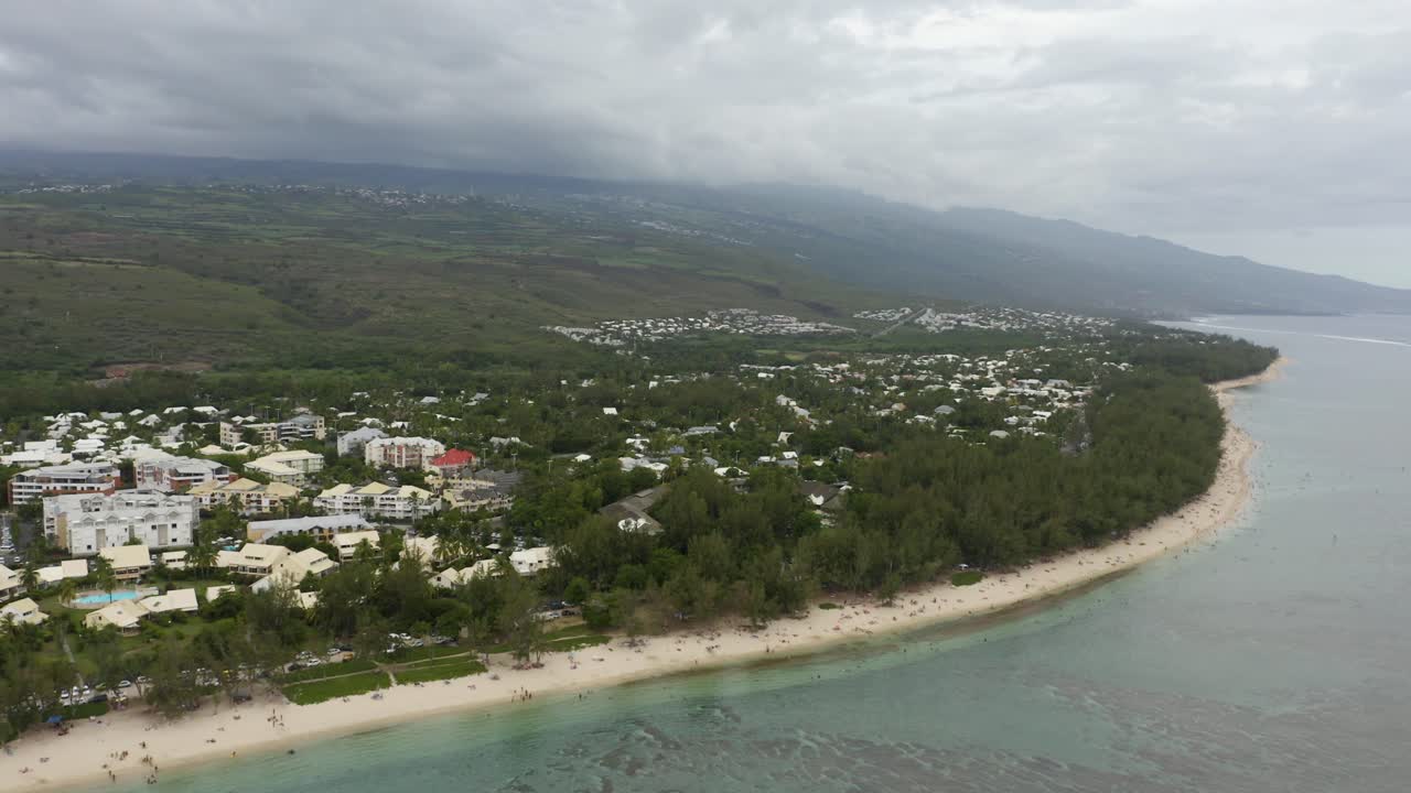Beautiful aerial view of tropical island coastline with coral reef and blue lagoon at Ermitage-les-Bains, Reunion Island, France