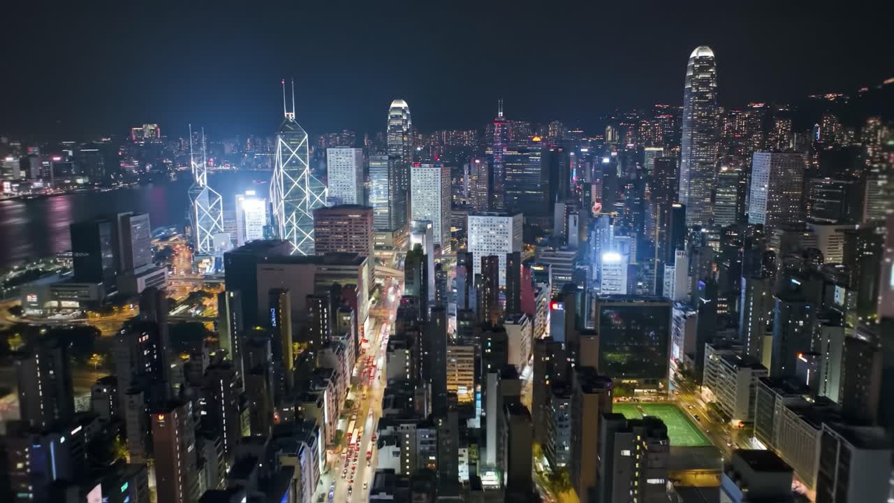 Experience the breathtaking view of Hong Kong's skyline as it sparkles at night, showcasing a vibrant city filled with towering buildings and bustling streets.