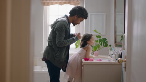 father-brushing-daughters-hair-in-bathroom-cute-little-girl-getting-ready-in-morning-loving-dad-enjoying-parenthood-caring-for-child