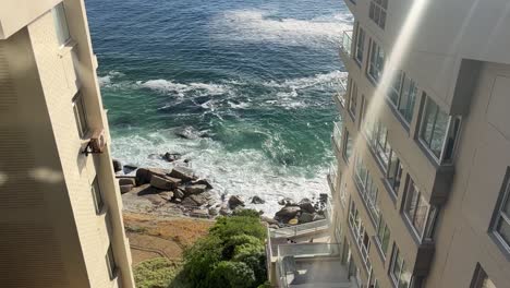 Ocean-tide-on-the-rocky-beach-at-Clifton-Beach-in-Cape-Town,-South-Africa