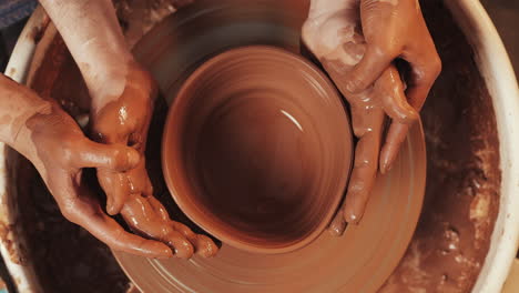creating pottery on the wheel