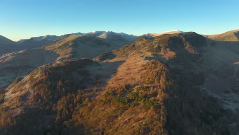 Frosty-mountains-and-wooded-hillsides-bathed-in-early-morning-sunlight