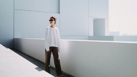 woman walking on a modern rooftop terrace