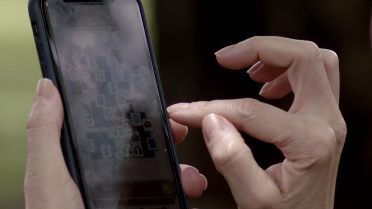 Mobile technology device, close-up view, person holding, useage