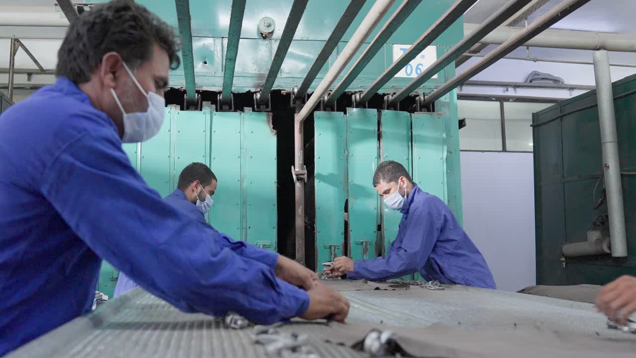 Factory Workers in a Textile Manufacturing Plant