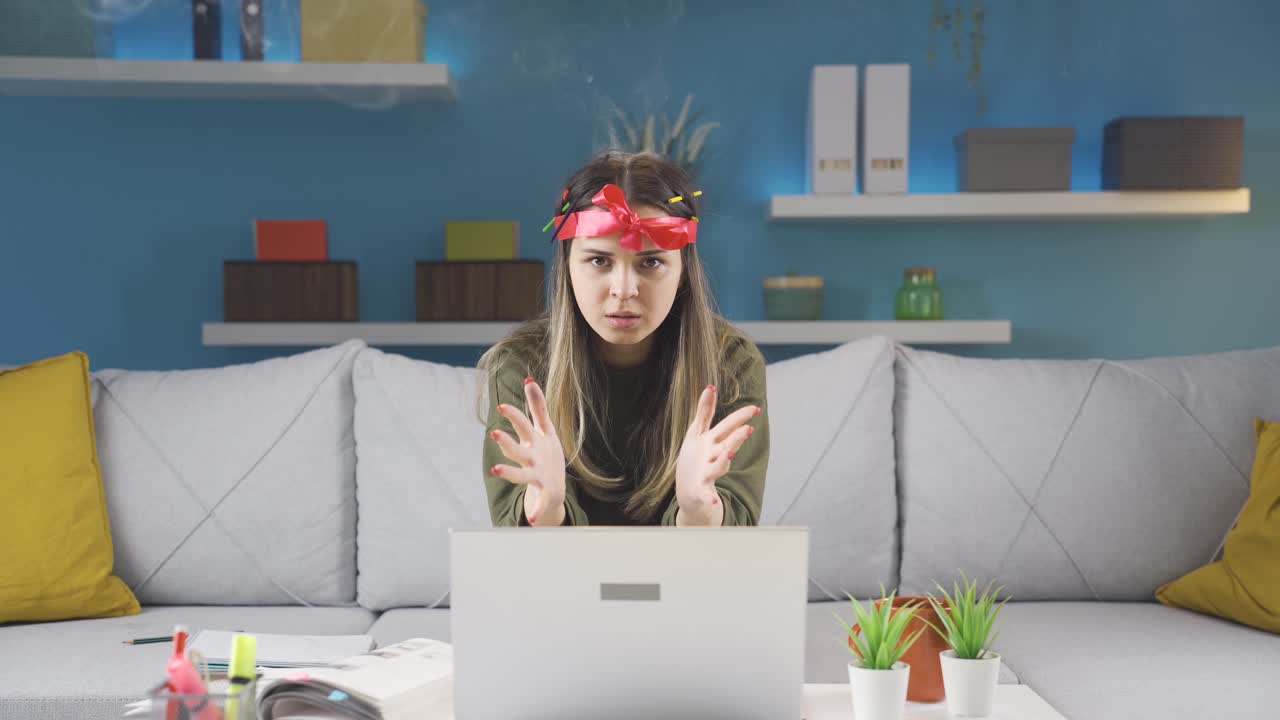 Frustrated young woman angry and smoke coming out of her head.