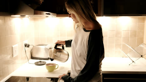 Woman-preparing-and-having-coffee-in-kitchen-4k