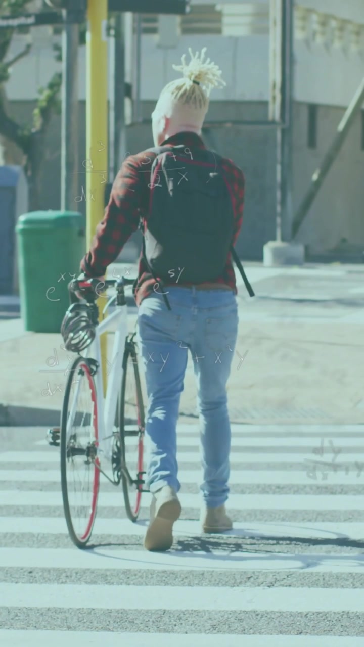 Vertical video: Man stepping onto crossing pushing white bike animated path guiding to transit rack