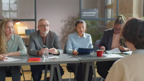 recruitment committee interviewing candidate in office