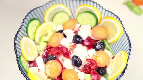 Man-Making-Salad-In-Kitchen