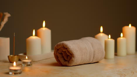 Still-Life-Of-Lit-Candles-With-Dried-Grasses-Incense-Stick-And-Soft-Towels-As-Part-Of-Relaxing-Spa-Day-Decor-6