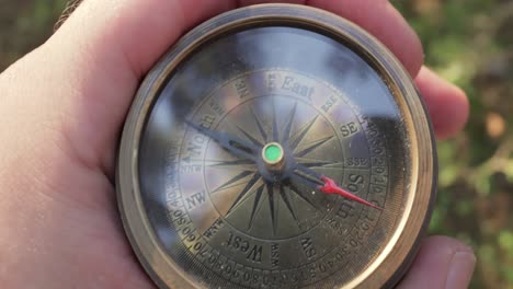 vintage compass in hand