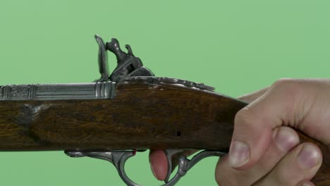 antique pistol on green screen