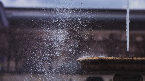 Super-slow-motion-footage-of-Grand-Bassin-Rond-fountain-by-the-Louvre-in-Paris,-France